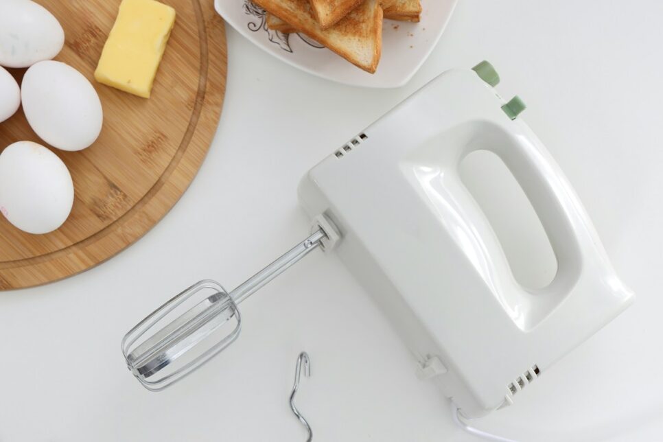 white apple earpods beside bread on white ceramic plate