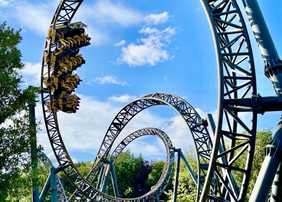 green and brown roller coaster under blue sky during daytime