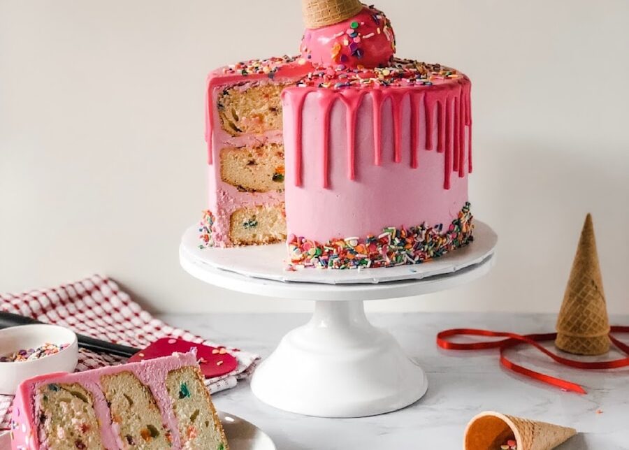 pink and white cake on white ceramic plate