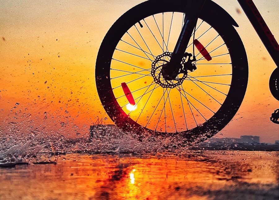 black bicycle on brown sand during sunset