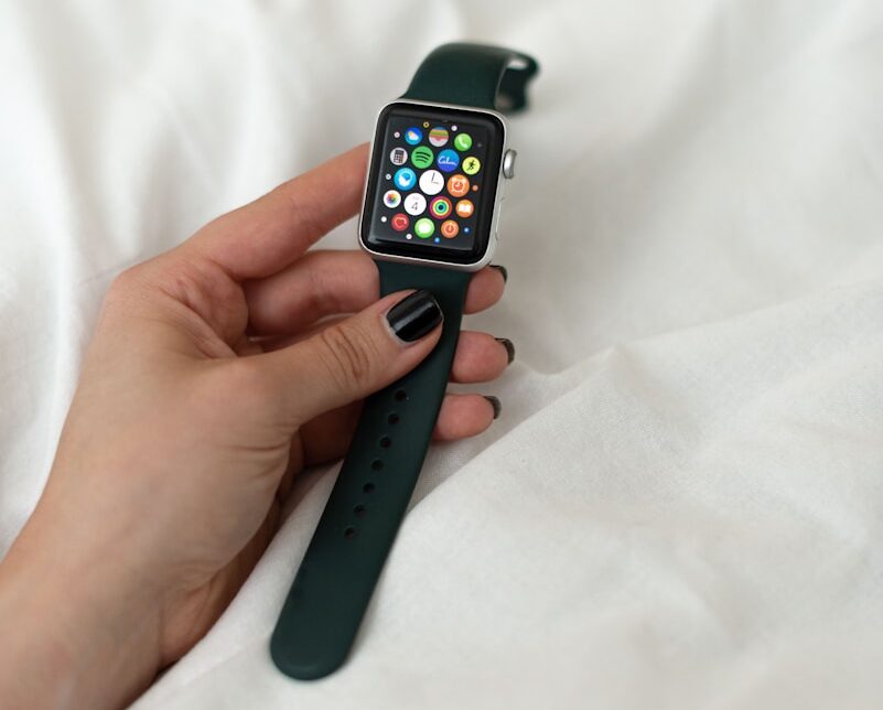 person holding black apple watch