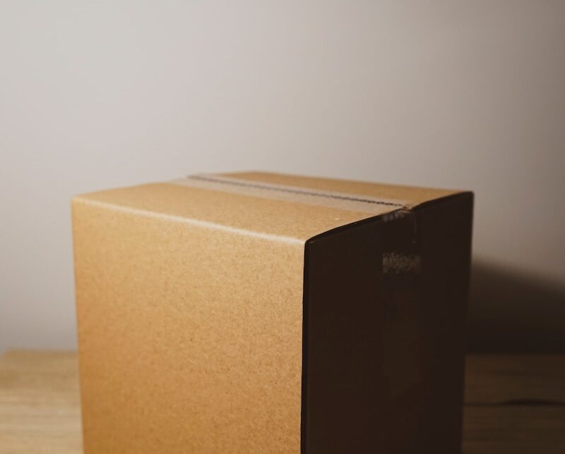 shallow focus photo of brown cardboard box