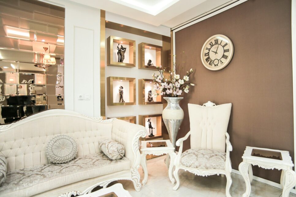 a living room filled with furniture and a clock on the wall