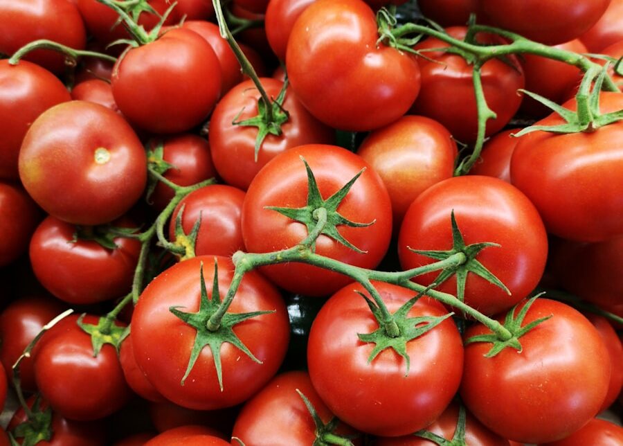red tomatoes on brown wooden table