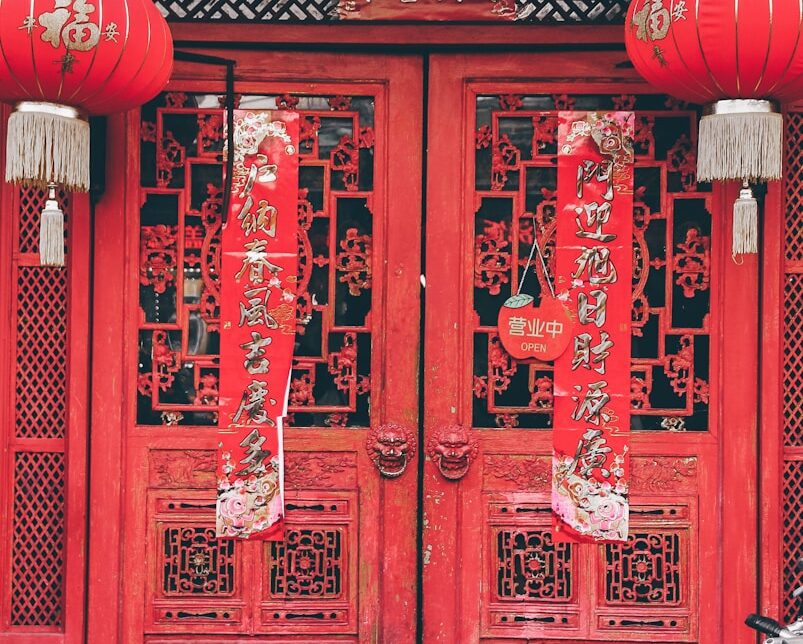 red chinese lanterns on red wooden door
