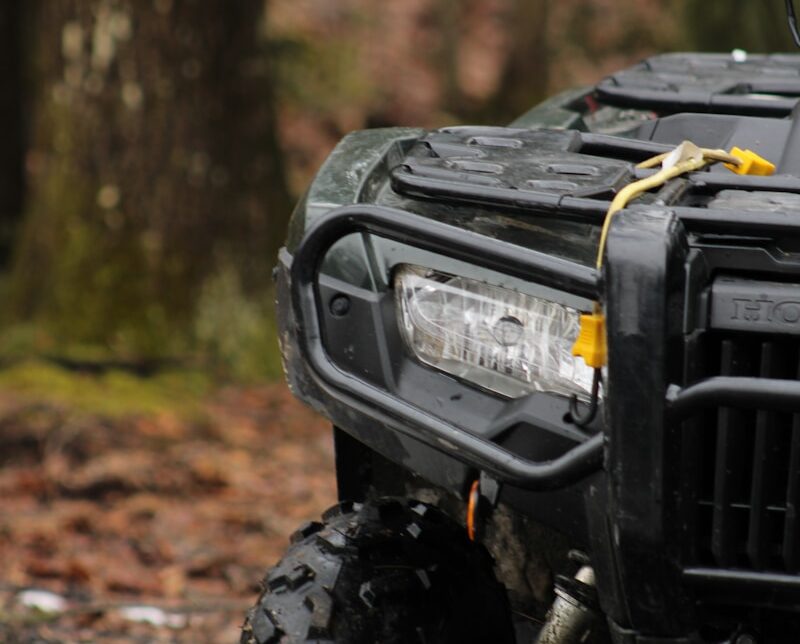 a four wheeler is parked in the woods