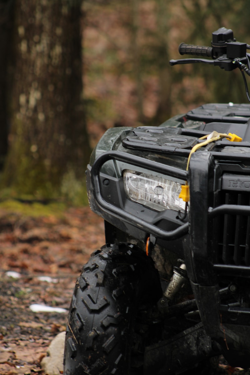 a four wheeler is parked in the woods